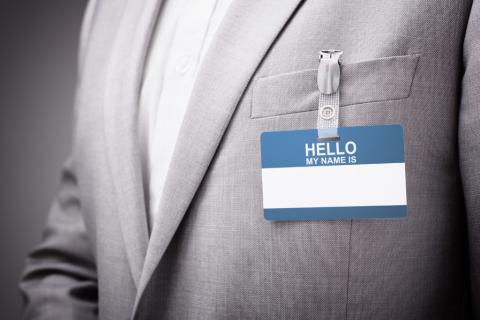 An image of a blank name tag pinned to someone's suit jackethttps://www.pinknews.co.uk/2020/02/29/legal-name-change-clinic-lgbt-university-minnesota-law-school-trans-non-binary/